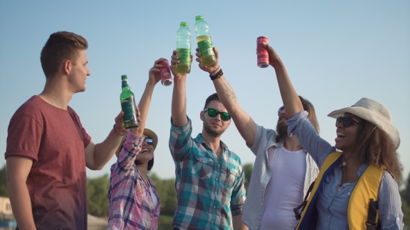 Group of Happy Young Adults Toasting Each Other