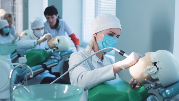 Students Practicing Dentistry on Medical Dummies