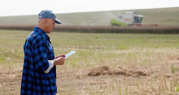 Agriculture Farmer Examining Field Modern Farming