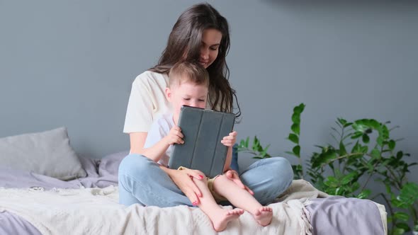 Mother and Son with Tablet at Home