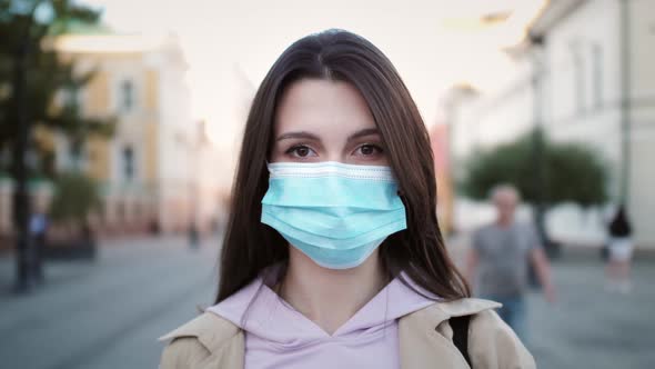 Young Hispanic Woman Wearing Protective Mask Against COVID Virus Tourist with Medical Mask Public