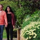 Young Latin couple walks through the garden with beautiful flowers in a very relaxed - VideoHive Item for Sale