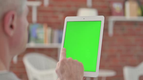 Senior Old Man Holding Tablet with Chroma Screen