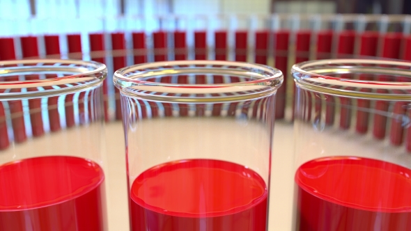 Ring of Laboratory Glass Vials with Blood or Red Liquid alt