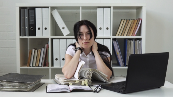 Woman Tired of Paperwork in the Office
