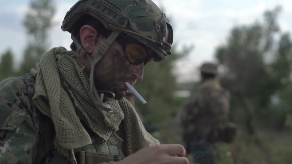Soldier Smoking Opposite Other Soldiers