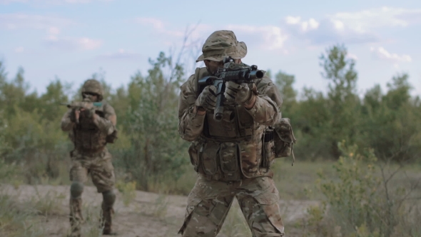 Military Forces Walking on Battlefield