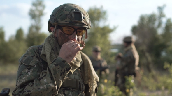Soldier Smoking Opposite Other Soldiers
