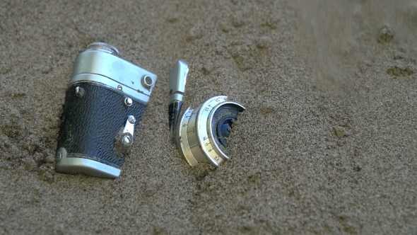Old Camera Forgotten in the Sand