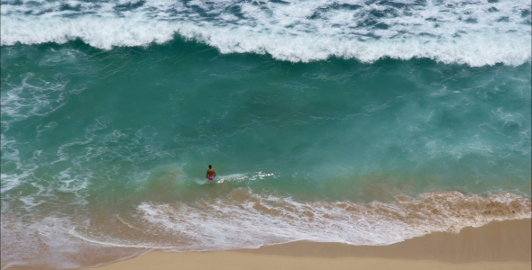 A Man Goes To Swim In The Ocean