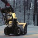 Snowcovered Man Cleans the Road in Winter with Blower Snow Removal Equipment - VideoHive Item for Sale