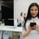 Asian Businesswoman Using Cell Smart Phone Standing In Office During Meeting Over Her Coworkers - VideoHive Item for Sale