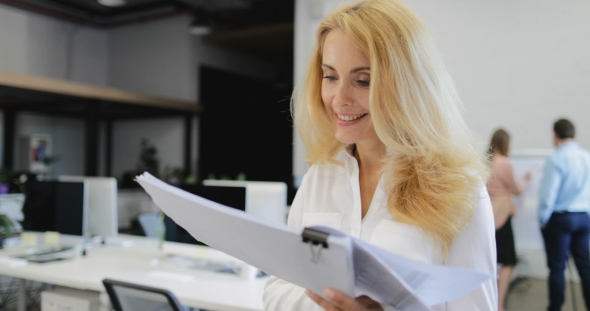 Happy Smiling Businesswoman Boss Reading Report Document Walks From Braistorming Meeting Of Business