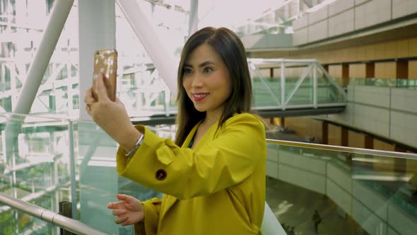 Japanese woman taking a selfie in Tokyo Japan