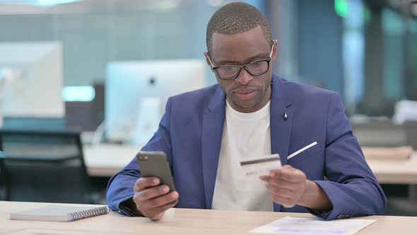 Successful Online Payment on Smartphone By African Businessman