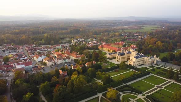 Aerial view of small town Lednice and castle yard with green gardens in Moravia, Czech Republic.