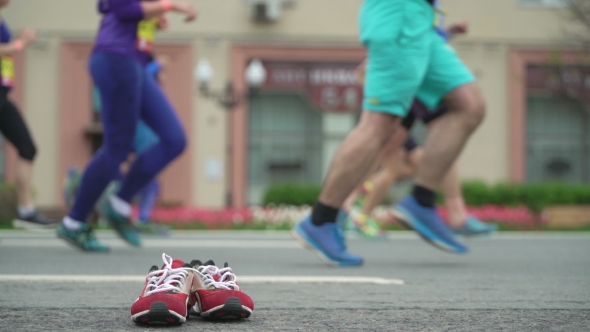 Running Athletes on Street, City Marathon, Unrecognizable Face and Logo. Concept Healthy Lifestyle