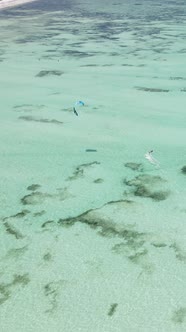 Tanzania  Vertical Video Kitesurfing Near the Shore of Zanzibar Slow Motion