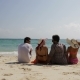 People Sitting On Beach Talking Back Rear View, Men And Women Communication Tourists Group On Summer - VideoHive Item for Sale