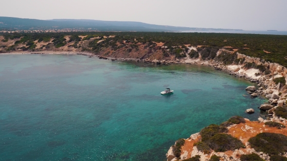 Aerial View White Boat in Clear Blue Lagoon