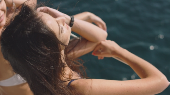 Young Sexy Girl on a Yacht at Summer Day