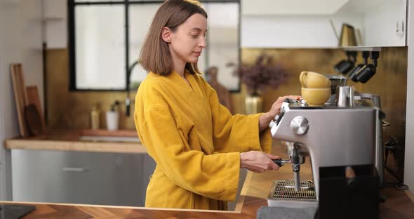 Woman Making Coffee in the Morning at Home