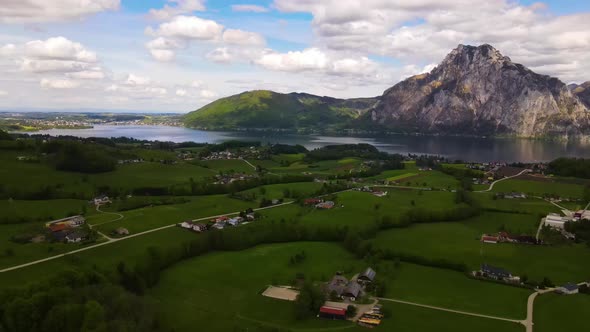 Beautiful view on the Mountains, lake and a Village Drone Video