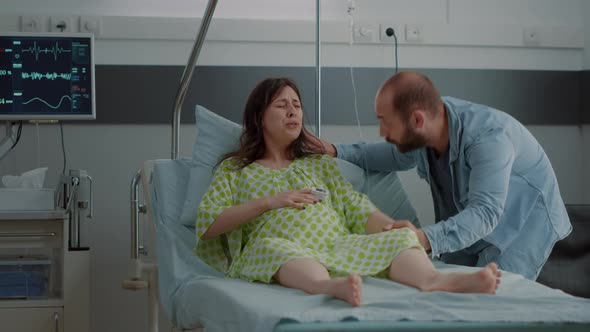 Young Woman Going Into Labor in Hospital Ward