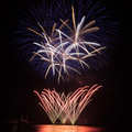 Firework over the water in the night sky - PhotoDune Item for Sale