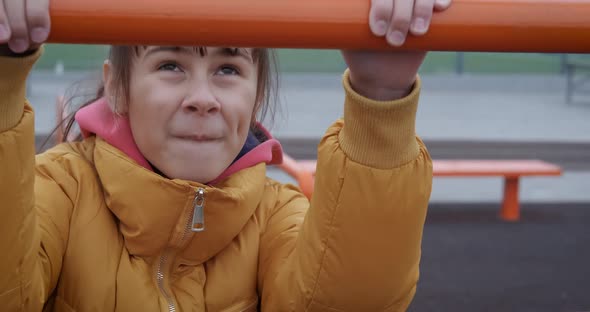 Child practicing on bars.