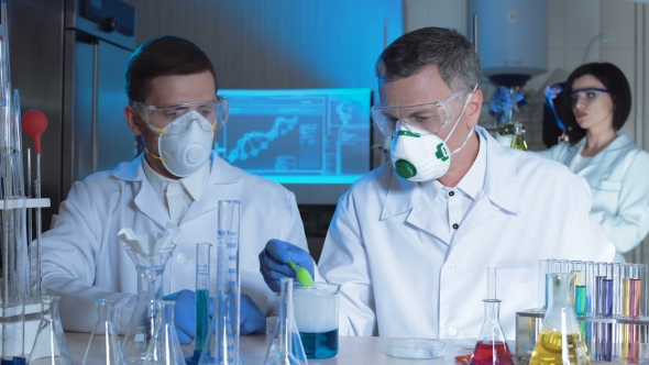 Group of Chemists Working in a Laboratory