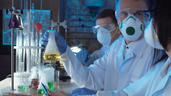 Group of Chemists Working in a Laboratory