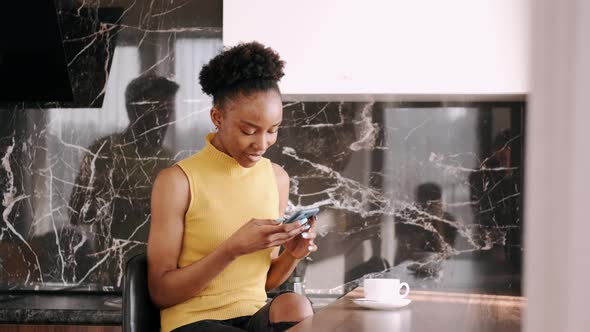 Black Woman Drinking Coffee in the Morning