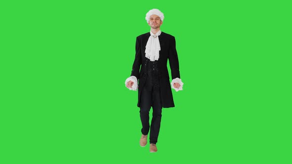 Man in Old-fashioned Laced Frock Coat and White Wig Walking in a Mannered Way Looking at Camera on a