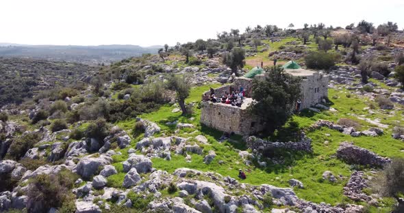 Aerial View of people in the old structure among the hills, Bi'r Saricah.