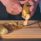 Man Is Peeling Potato in a Kitchen - VideoHive Item for Sale