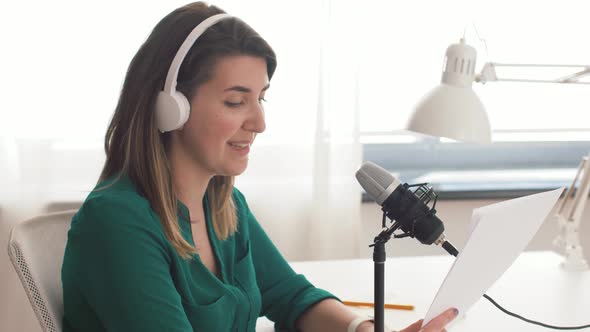 Woman with Microphone Recording Podcast at Studio