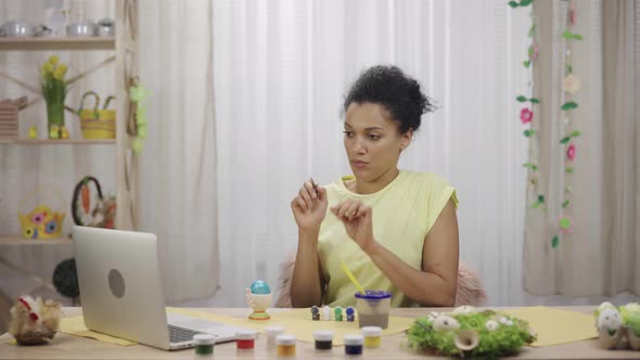 Cute African American Woman Talking By Video Call on Laptop