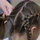 Woman Braiding Hair of Her Daughter in the Kitchen - VideoHive Item for Sale