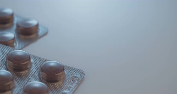 Prescription drugs - Capsules, pills, tablets on reflective background