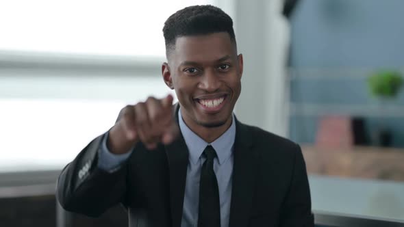 Portrait of African Businessman Pointing at the Camera