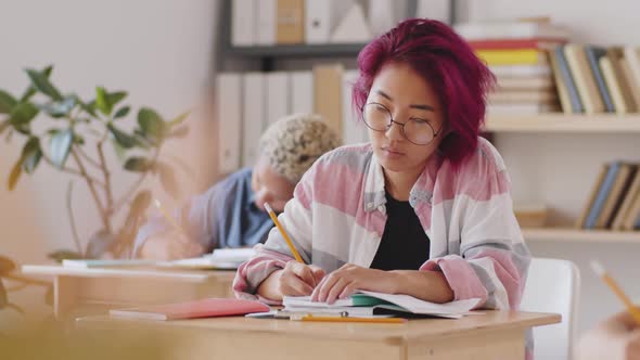 Portrait of Positive Asian Female Student at Lecture