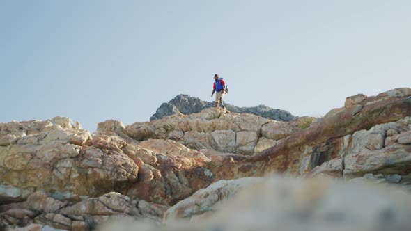 Sporty mixed race man with prosthetic leg hiking