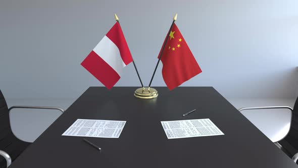 Flags of Peru and China on the Table alt