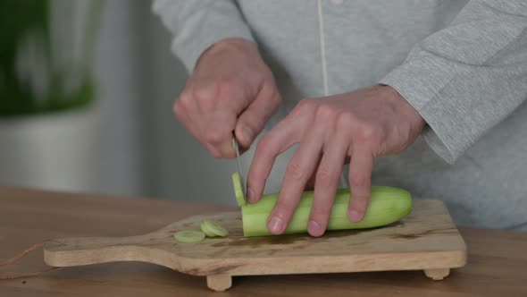 Close Up Shot of Hands of Man Spreading Butter on Bread