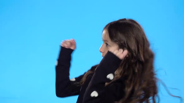 Girl Rejoicing About Something, Smiling, Showing Thumbs Up and Dancing.