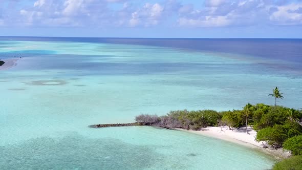 Drone aerial panorama of lagoon beach by blue ocean with sand background