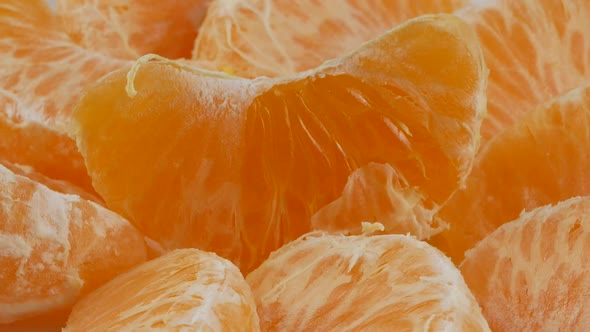 Tangerines or mandarin orange fruits and peeled segment.