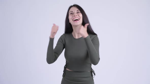 Happy Young Beautiful Woman Looking Excited While Giving Thumbs Up