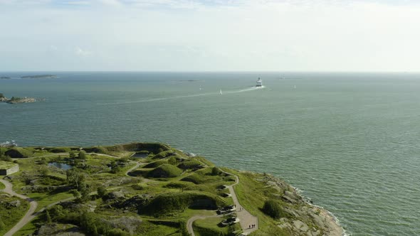 Aerial view of a Cruise liner ferry,ing away from Suomenlinna island, sunny, summer day, in Helsinki